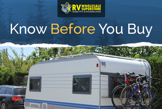 Small RV travel trailer with bicycle on rack