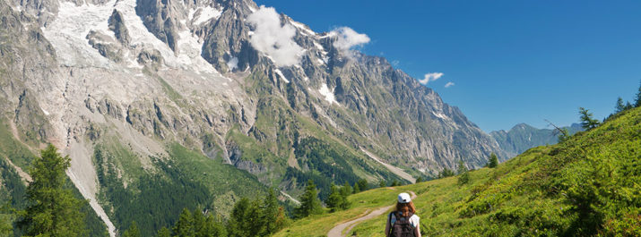 A woman hiking through a trail in a US National Park.