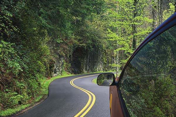 Car driving down an RV travel route for the Great Smoky Mountains